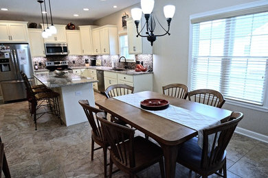 Kitchen - mid-sized transitional kitchen idea in Other