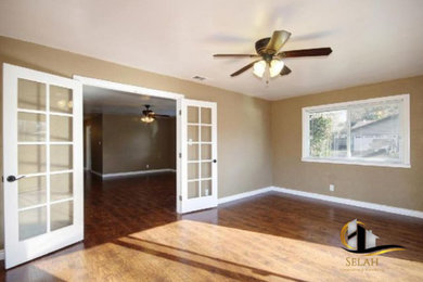 Inspiration for a mid-sized contemporary laminate floor and brown floor kitchen/dining room combo remodel in Tampa with beige walls