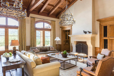 Living room - huge mediterranean formal and open concept medium tone wood floor and brown floor living room idea in San Francisco with beige walls, a standard fireplace, a stone fireplace and no tv