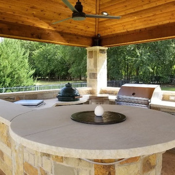 Prosper - Freestanding patio with outdoor kitchen, fireplace and firepit.