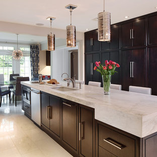 This is an example of a large contemporary l-shaped kitchen pantry in New York with an undermount sink, flat-panel cabinets, dark wood cabinets, marble benchtops, multi-coloured splashback, porcelain splashback, stainless steel appliances, marble floors and with island.
