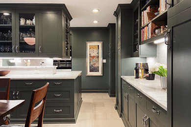 Enclosed kitchen - mid-sized transitional l-shaped marble floor and beige floor enclosed kitchen idea in Other with an undermount sink, shaker cabinets, green cabinets, quartzite countertops, white backsplash, ceramic backsplash, stainless steel appliances, a peninsula and gray countertops