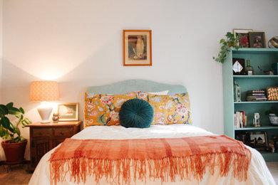 Bedroom - mid-sized eclectic guest carpeted and beige floor bedroom idea with white walls