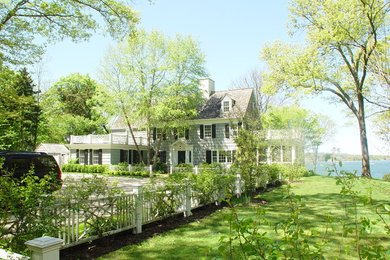 Photo of a traditional partial sun side yard driveway in New York.