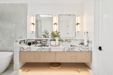 Inspiration for a large transitional master gray tile and matchstick tile porcelain tile, gray floor and double-sink bathroom remodel in Orange County with light wood cabinets, a bidet, gray walls, an undermount sink, marble countertops, white countertops, a floating vanity and shaker cabinets