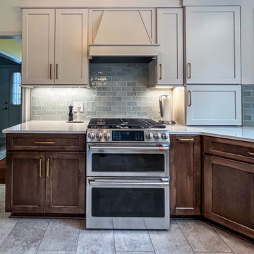 Two Tone Kitchen with Wood and Beige Cabinetry with Quartz Countertops