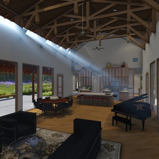 Mittelgroßes, Abgetrenntes Mediterranes Wohnzimmer mit Kamin, Kaminsims aus Stein und Bambusparkett in Houston