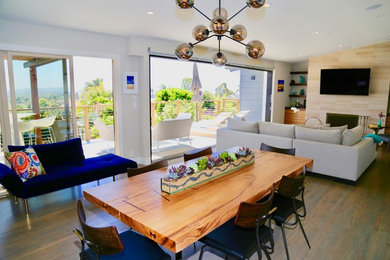 Kitchen/dining room combo - mid-sized transitional light wood floor and brown floor kitchen/dining room combo idea in Seattle with gray walls and no fireplace