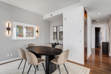 Example of a minimalist dining room design in Montreal