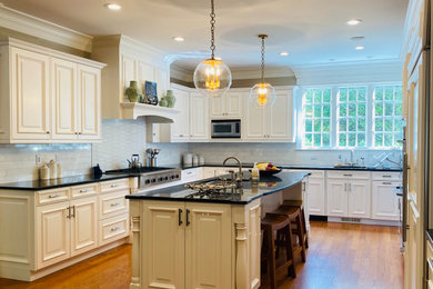 Example of a transitional kitchen design in New York