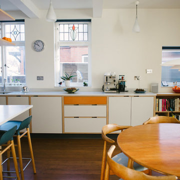 The Hennessy- Jones’s: Orange & White Laminated Plywood Kitchen