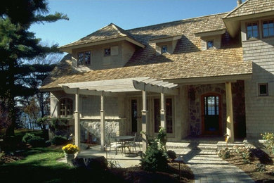 Inspiration for a timeless beige two-story mixed siding exterior home remodel in Minneapolis