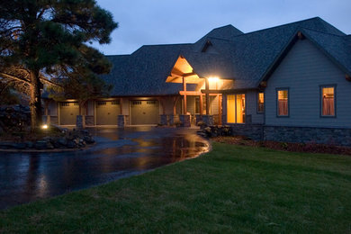 Large traditional gray two-story mixed siding exterior home idea in Other with a shingle roof