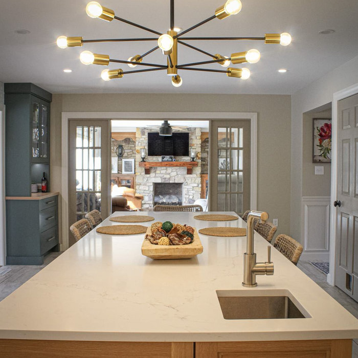 This view captures several of the details that shaped the personality and function of this award-winning kitchen. The prep sink was relocated to the expansive white oak island, creating a dedicated pr