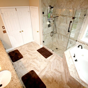 Master Bathroom with Frameless Shower and Jetted Tub