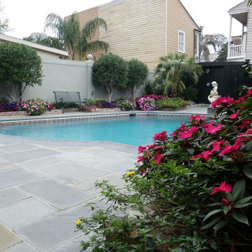 Pool, waterfall, and landscaping