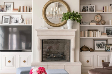 Inspiration for a timeless open concept light wood floor, beige floor and exposed beam living room remodel in Raleigh with white walls, a standard fireplace and a media wall