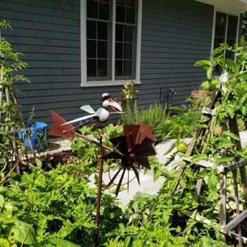 An extensive landscape project with stonewalls, patio, dry river bed & more