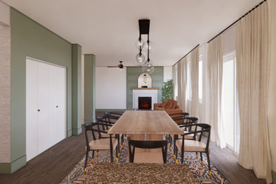 Imagen de comedor minimalista de tamaño medio cerrado con paredes verdes, suelo de madera en tonos medios, todas las chimeneas, marco de chimenea de madera y suelo marrón