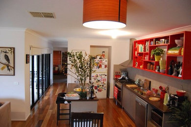 Photo of a mid-sized eclectic home design in Melbourne.