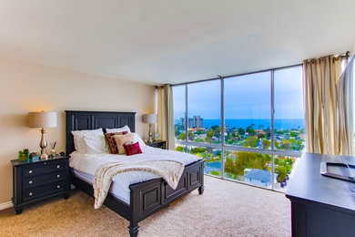 Example of a mid-sized trendy guest carpeted bedroom design in San Diego with white walls
