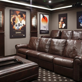 Inspiration for a mid-sized timeless enclosed carpeted and multicolored floor home theater remodel in Tampa with a projector screen and gray walls