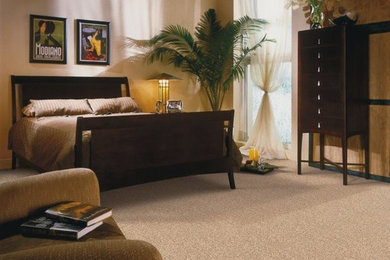 Bedroom - mid-sized tropical master carpeted and brown floor bedroom idea in Other with yellow walls and no fireplace