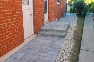 Patio - mid-sized traditional backyard stone patio idea in Phoenix with no cover