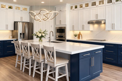 Example of a large trendy ceramic tile and beige floor eat-in kitchen design in Tampa with a drop-in sink, shaker cabinets, blue cabinets, quartz countertops, quartz backsplash, stainless steel appliances, an island and white countertops