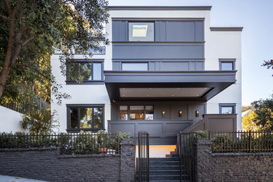 Contemporary white three-story flat roof idea in San Francisco