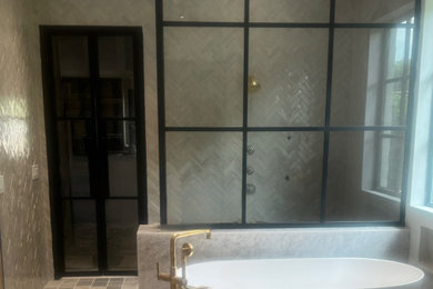 Bathroom - large industrial master beige tile cement tile floor and brown floor bathroom idea in Dallas with beige walls