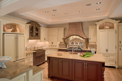 This is an example of a large country l-shaped eat-in kitchen in Philadelphia with an undermount sink, beaded inset cabinets, beige cabinets, granite benchtops, beige splashback, ceramic splashback, travertine floors and with island.