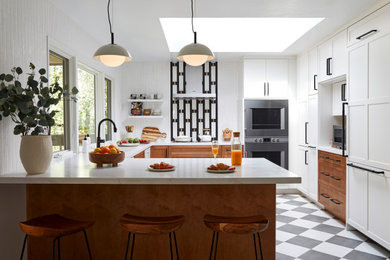 Large transitional u-shaped gray floor eat-in kitchen photo in San Francisco with shaker cabinets, white cabinets, quartzite countertops, white backsplash, mosaic tile backsplash, stainless steel appliances, a peninsula and white countertops