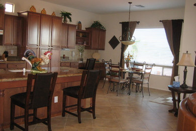 Kitchen/dining room combo - mid-sized southwestern vinyl floor kitchen/dining room combo idea in Tampa with beige walls