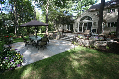 This is an example of a mid-sized transitional landscaping in Boston.