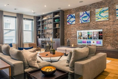Inspiration for a large contemporary open concept light wood floor living room remodel in New York with white walls, no fireplace and a wall-mounted tv