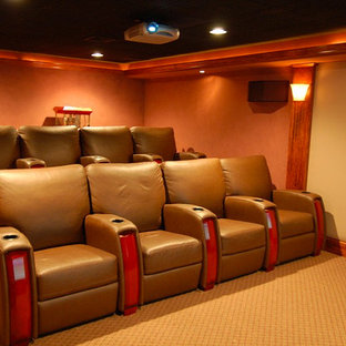 Medium sized contemporary enclosed home cinema in Providence with beige walls, carpet and a projector screen.