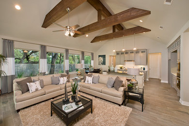 Inspiration for a mid-sized transitional formal and open concept vinyl floor and brown floor living room remodel in Houston with gray walls, no fireplace and no tv