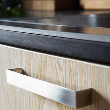 Oiled Birch Veneer Door with Stainless Steel Handle and Ceramic Worktop.