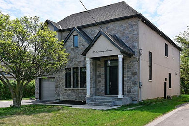 Transitional exterior home idea in Toronto
