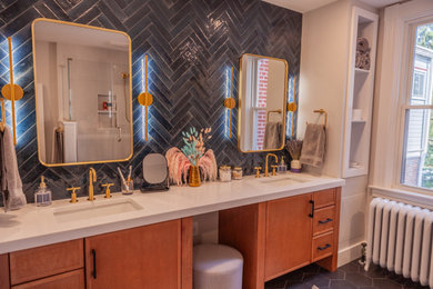 Mid-sized trendy master blue tile and subway tile porcelain tile, black floor and double-sink bathroom photo in Other with flat-panel cabinets, medium tone wood cabinets, a two-piece toilet, beige walls, an undermount sink, quartz countertops, a hinged shower door, white countertops and a built-in vanity