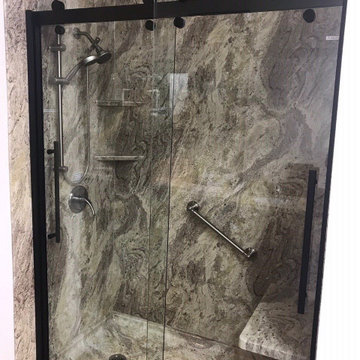 Valencia Granite smooth wall shower w/ Cayman Style Door