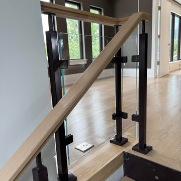 Project #136 | Modern Floating Staircase Encircling Glass Elevator