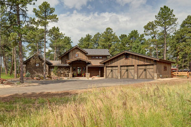 Rustic exterior home idea in Denver