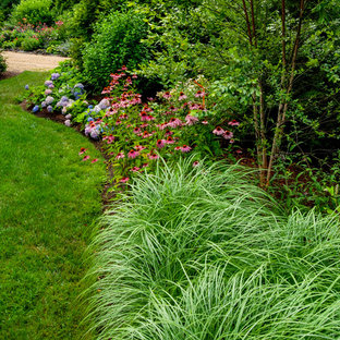 Photo of a mid-sized country side yard shaded garden in Boston with with flowerbed.