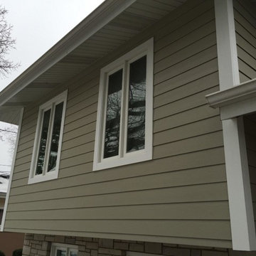 Modern upgrade with James Hardie fiber cement siding and stone siding