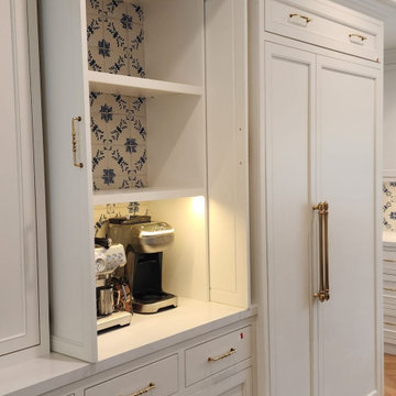 Custom coffee station with white cabinetry and brass hardware in a Westlake Vill