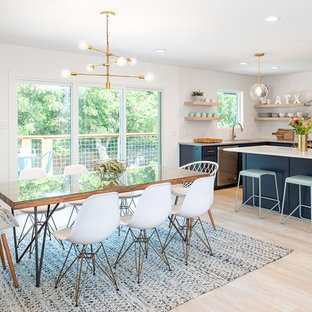 Example of a mid-sized 1950s light wood floor and beige floor kitchen/dining room combo design in Austin with white walls and no fireplace