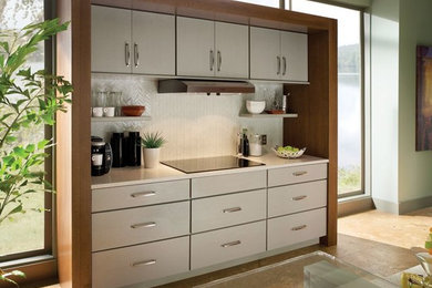 Inspiration for a mid-sized scandinavian single-wall cork floor and brown floor open concept kitchen remodel in Boston with flat-panel cabinets, white cabinets, quartz countertops, white backsplash, porcelain backsplash, stainless steel appliances and an island