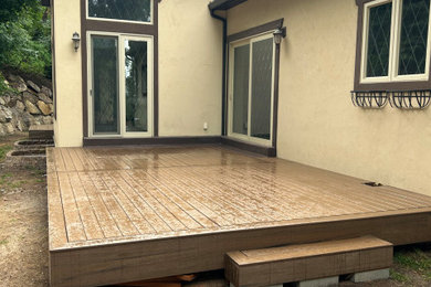 Deck - mid-sized backyard ground level deck idea in Salt Lake City